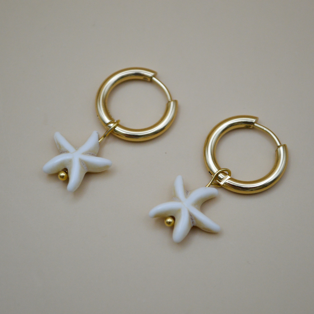 Huggies gold con estrella de mar beige colgante (2 en 1)