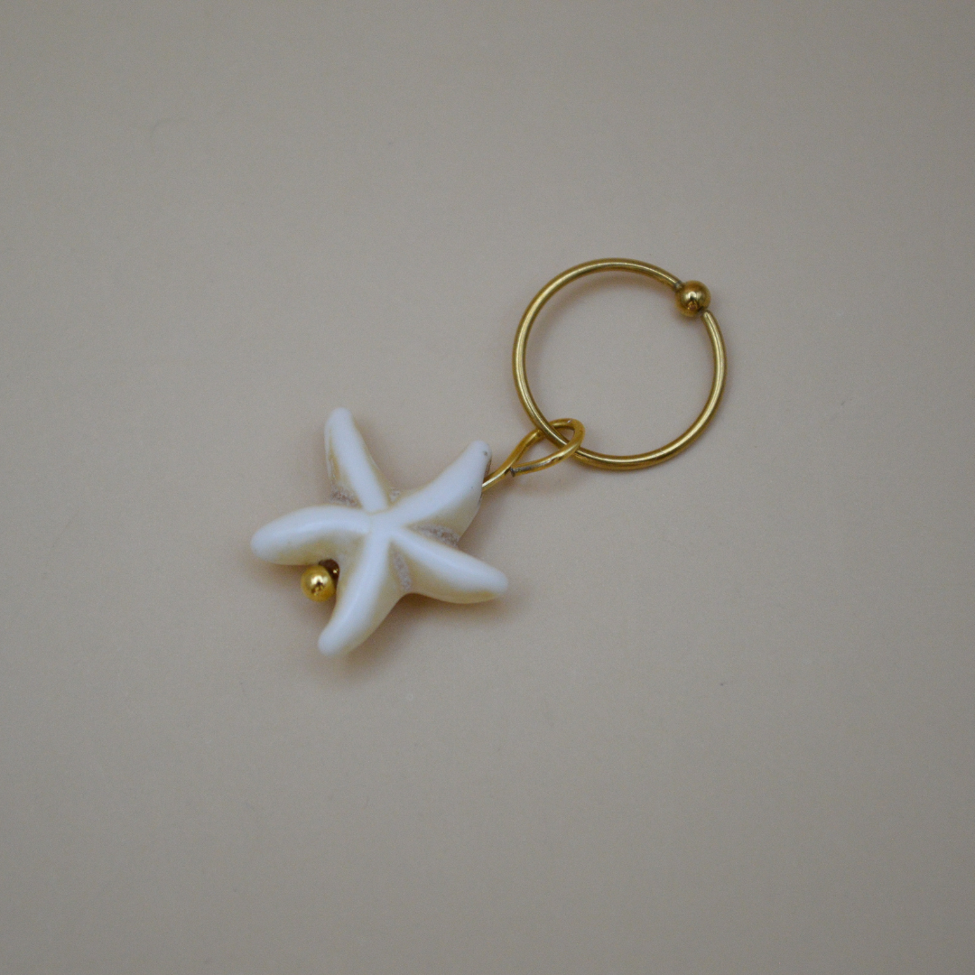 Piercing estrella de mar beige