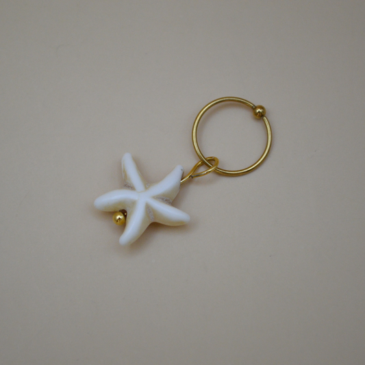 Piercing estrella de mar beige