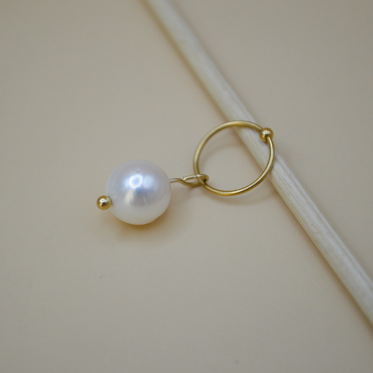 Piercing perla de río